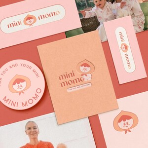 May include: A collection of pink and peach-colored stationery items featuring the "mini momo" logo. The logo includes a peach character. The items include business cards, a round sticker, and a greeting card. The text "FOR YOU AND YOUR MINI" is also visible.