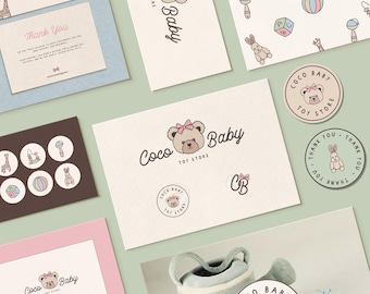 May include: A collection of branding materials for a toy store called "Coco Baby". The logo features a cartoon bear with a pink bow. The branding includes business cards, thank you cards, stickers, and a pattern with toys.