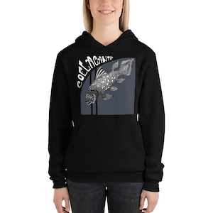May include: Black hoodie with a white graphic of a coelacanth fish on a blue background. The text "COELACANTH" is written in a white, stylized font.
