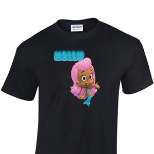May include: Black t-shirt with a cartoon image of a pink-haired mermaid character with a blue tail. The text "Molly" is above the character in blue bubble letters.