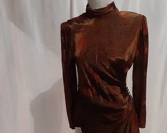 May include: A brown and red patterned long-sleeved dress with a high neck and a fitted silhouette.
