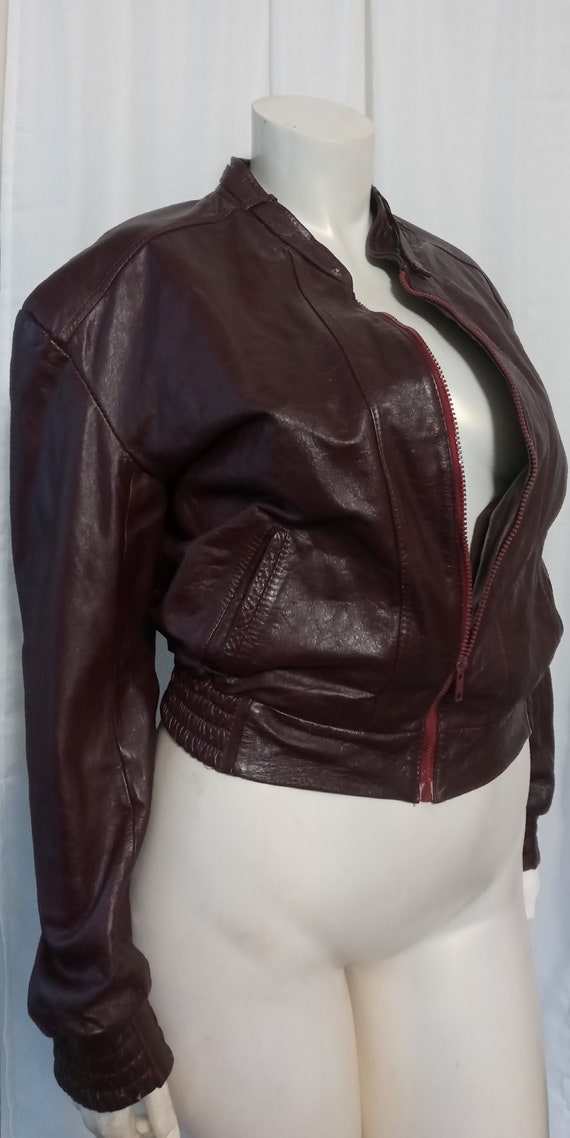 Vintage burgundy leather bomber jacket