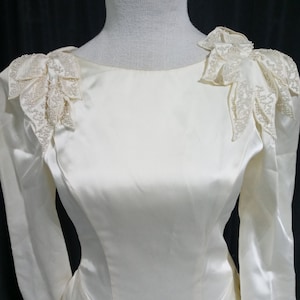 Vintage off white wedding gown with shoulder detail