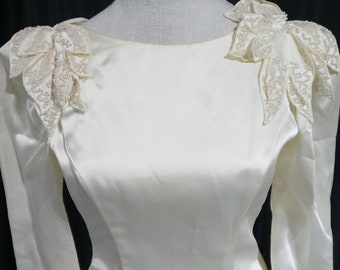 Vintage off white wedding gown with shoulder detail