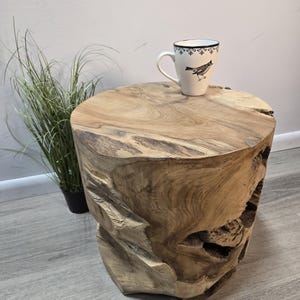 May include: A white ceramic mug with a black handle and the text "But First, Coffee" in a black, bold font. The mug is likely 11-15 ounces in size, perfect for a morning beverage.