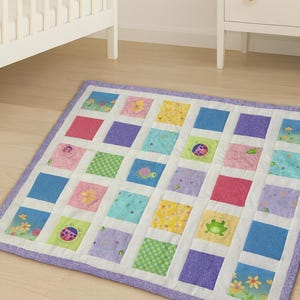 May include: A set of three ceramic mugs with a speckled, matte finish. Each mug features a different color: light blue, cream, and gray. The mugs have a simple, modern design with a rounded shape and a handle.