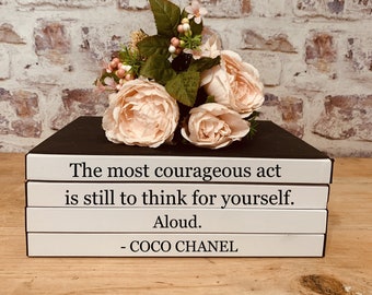 Chic and Thought-Provoking: Coco Chanel Books Stacks with Bold Quote