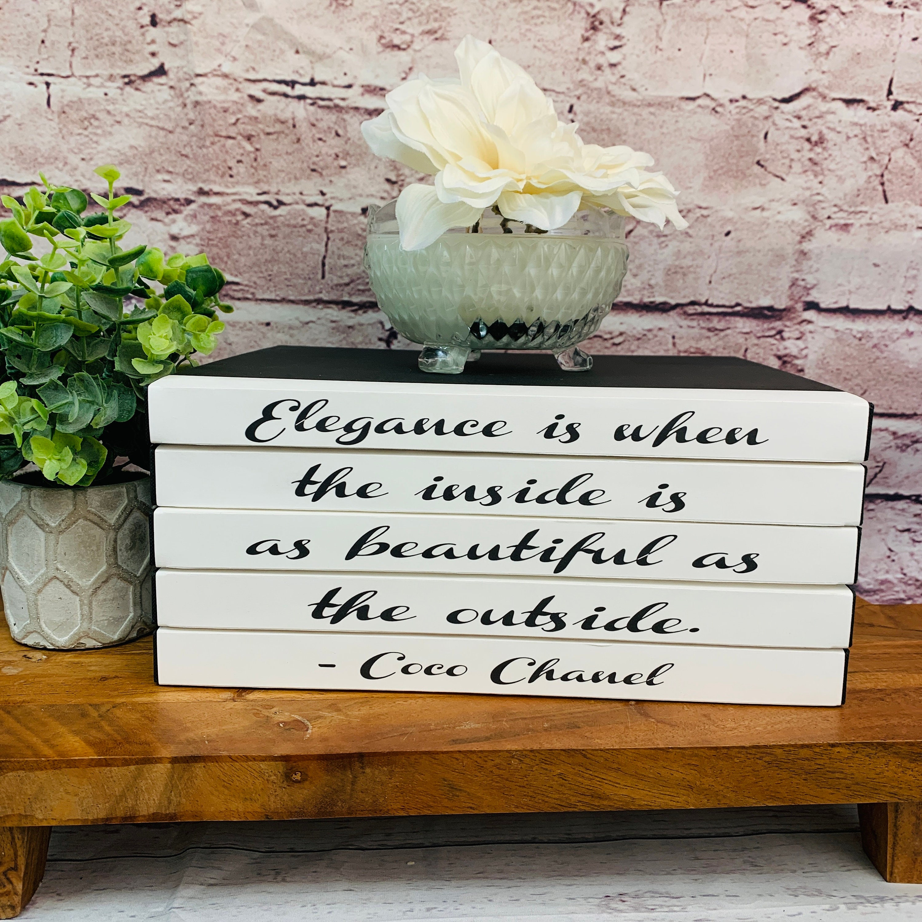 Stack of White Leather Bound Books with Coco Chanel Quote