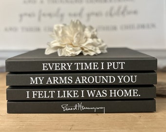 Modern Coffee Table Book Stacks featuring Ernest Hemingway's Wisdom on Love and Home