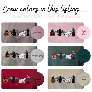 May include: Six crew neck sweatshirts in different colors with a Halloween themed design. The design features a jack-o-lantern, a black cat with wings, a white polar bear, and a black cat wearing a witch's hat. The colors are: paragon, light pink, heather gray, forest green, cardinal, and sand.