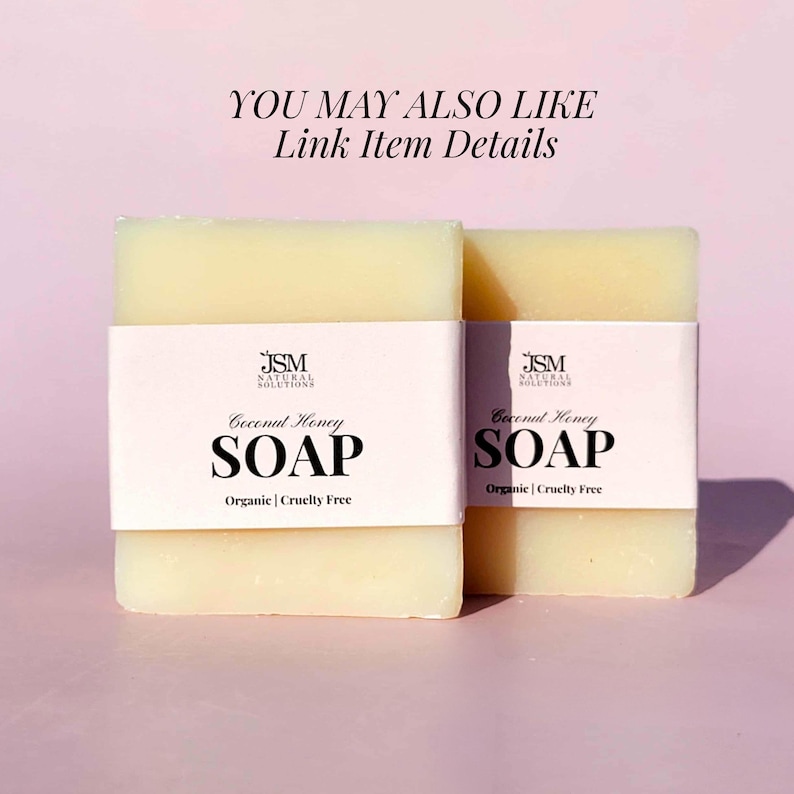 May include: Two bars of Coconut Honey soap with white labels. The labels display the text "JSM NATURAL SOLUTIONS", "Coconut Honey SOAP", and "Organic | Cruelty Free". The soap bars are light yellow and sit on a pink background.