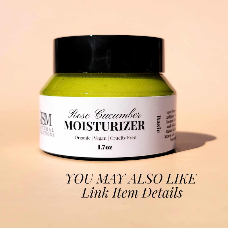 May include: A jar of Rose Cucumber Moisturizer with a black lid. The label reads "Rose Cucumber MOISTURIZER" and "Organic | Vegan | Cruelty Free". The jar contains 1.7 oz of product. The text "YOU MAY ALSO LIKE Link Item Details" is at the bottom.
