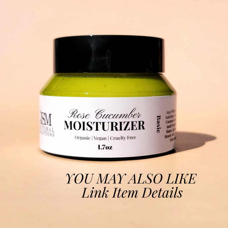 May include: A jar of Rose Cucumber Moisturizer with a black lid. The label reads "Rose Cucumber MOISTURIZER" and "Organic | Vegan | Cruelty Free". The jar contains 1.7 oz of product. The text "YOU MAY ALSO LIKE Link Item Details" is at the bottom.