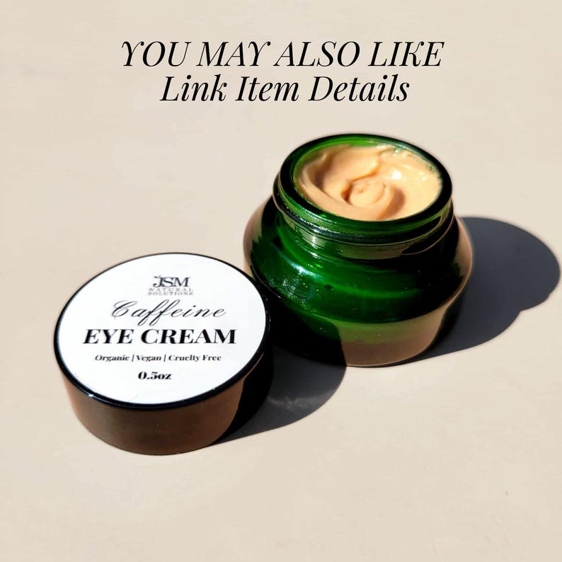 May include: A jar of green glass eye cream with a light orange cream inside, next to a jar lid with the words "Caffeine EYE CREAM" and "0.5oz" printed on it. The text "YOU MAY ALSO LIKE Link Item Details" is at the top.