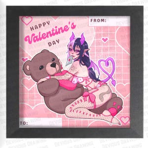 May include: Framed print with a Valentine's Day theme. The artwork features a cartoon character with devil horns and wings, embracing a teddy bear. The background is pink with hearts and the text "Happy Valentine's Day".