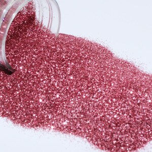 Strawberry extra fine glitter 2.5 Oz shaker Sold by weight not volume.