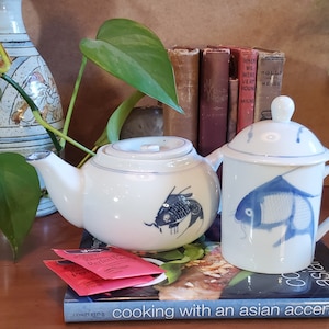 Chinese blue and white koi  teapot and tea cup with lid