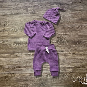 Newborn baby girl purple waffle knit going home outfit with matching hat. Sassy Jo's Babies and Bows