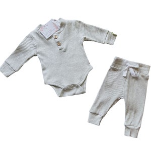 Newborn gender neutral take home outfit. light grey ribbed clothing henley bodysuit and pants. Sassy Jo's Babies and Bows.