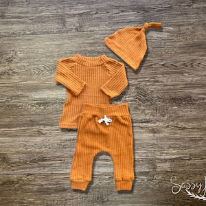 Newborn Gender Neutral going home waffle knit rust orange fall outfit with hat. Sassy Jo's Babies and bows.