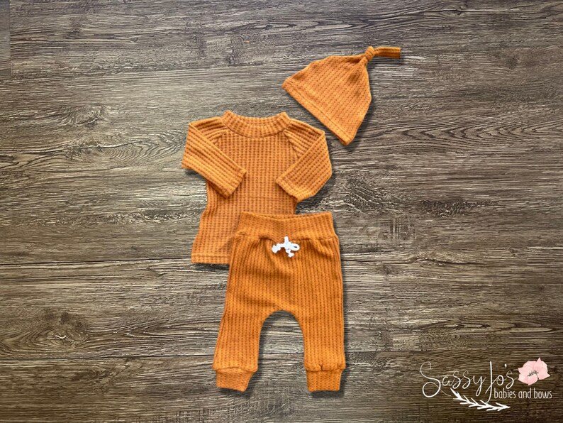Newborn Gender Neutral going home waffle knit rust orange fall outfit with hat. Sassy Jo's Babies and bows.