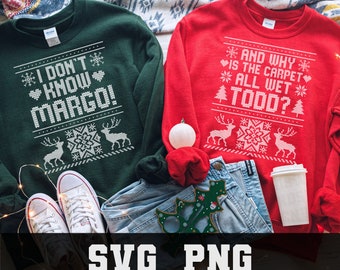 May include: Two Christmas-themed sweatshirts, one green and one red, with white text. The green sweatshirt says "I DON'T KNOW MARGO!" and the red one says "AND WHY IS THE CARPET ALL WET TODD?". The image also includes jeans, shoes, and holiday decorations.