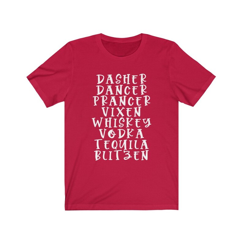 May include: A red t-shirt with white text. The text includes the names of Santa's reindeer, followed by the names of alcoholic beverages. The shirt is a crew neck and has short sleeves.