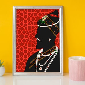 May include: A framed silhouette print of a person wearing a turban and jewelry against a red background with a geometric pattern.