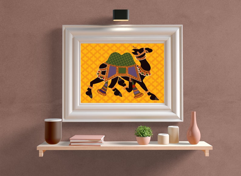 May include: A framed print of a black camel with a green and blue saddle, walking on a yellow background with a repeating pattern.