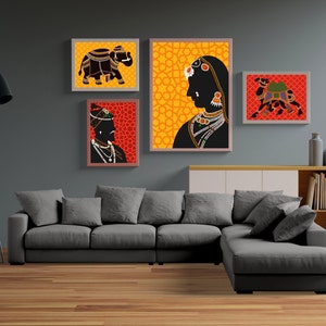 May include: Four framed illustrations of Indian cultural figures and animals. The illustrations are in a traditional style with black silhouettes on a colorful background. The frames are all the same size and shape, and they are arranged in a grid pattern on a gray wall.
