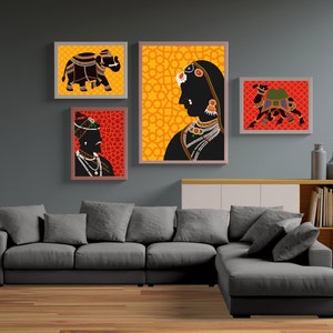 May include: Four framed prints with a yellow and orange geometric pattern, a black silhouette of an elephant, a black silhouette of a camel, and a black silhouette of a person wearing a turban and jewelry. The prints are hanging on a gray wall above a gray sectional sofa.