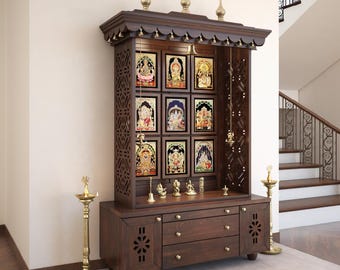 May include: A dark brown wooden home temple unit featuring a carved top with three finials and hanging bells. The structure includes nine framed religious images, a central shelf with small brass figurines, and a base with two drawers and cabinets.