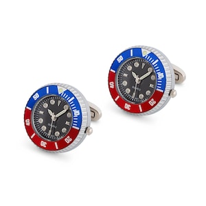May include: A pair of silver cufflinks with a black face watch design. The watch face has red and blue accents and the words "QUARTZ" and "JAPAN MVT" printed on it.