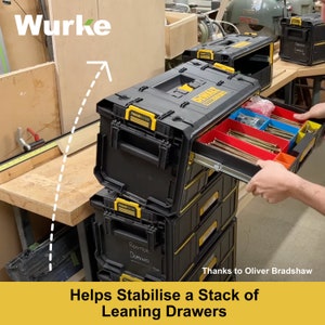 May include: A stack of black and yellow toolboxes with drawers. The top toolbox has a drawer open, revealing a variety of screws and other small hardware. The text "ROUTER" and "DOMINO" is written on the side of the toolbox.