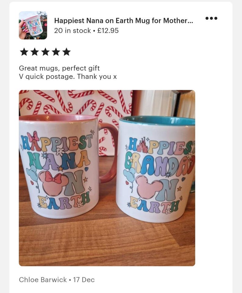 May include: Two white ceramic mugs with colourful text and images. The mug on the left says "Happiest Nana on Earth" and features a pink Mickey Mouse head with a bow. The mug on the right says "Happiest Grandad on Earth" and features a pink Mickey Mouse head. Both mugs have a light blue and pink rim.