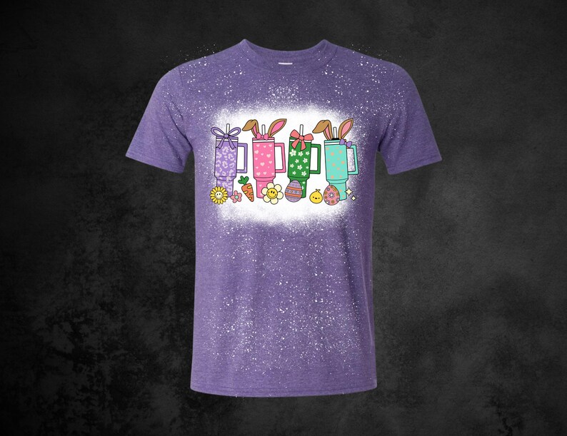 May include: A white ceramic mug with a black handle and the text "But First, Coffee" in a bold, black font. The mug is set against a blurred background, suggesting a cozy setting. The mug appears to be approximately 4 inches tall.