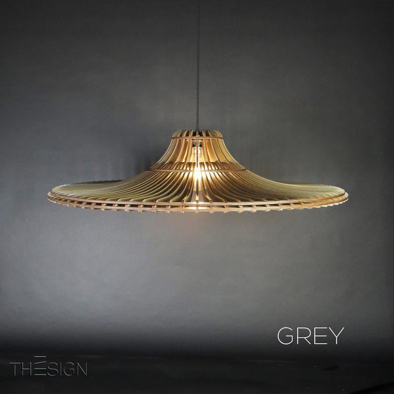 May include: A grey wooden pendant light with a wide, flat, circular shade. The shade is made of thin, slatted wood and has a slightly curved, conical shape.