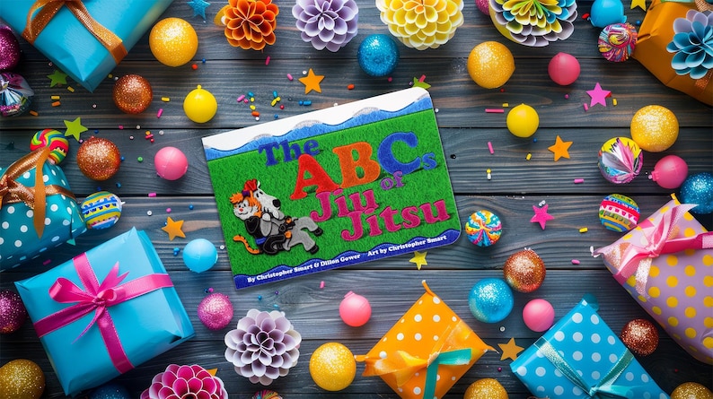 May include: A colorful book titled "The ABC's of Jiu Jitsu" by Christopher Stuart & Damon Garner. The book cover features a green background with a cartoon illustration of a person in a blue gi practicing jiu jitsu.