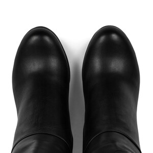 handcrafted tall boots for women made from soft black leather. Stabile block heels to feel good and side zipper for your own comfort. Custom wide calf size boots are available in leatherbyhannako store. Elegant heeled shoes for any occasion.