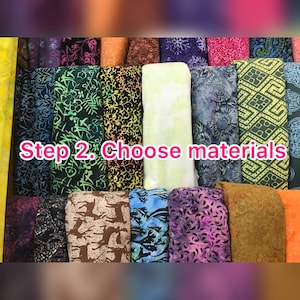 May include: A display of colorful fabric rolls with various patterns, including floral, geometric, and abstract designs. The text "Step 2. Choose materials" is overlaid on the image, suggesting a selection process. The fabrics are in shades of green, blue, purple, and orange.
