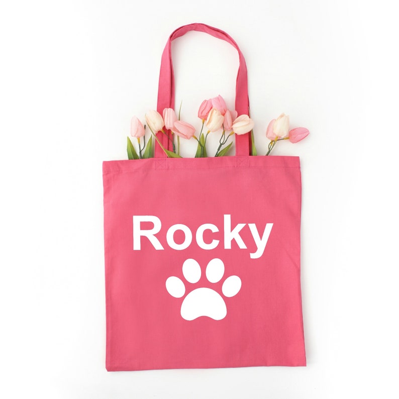 Let the world know you are an animal lover with the name of your special pet on a tote with paw designs use as a grocery tote or book bag