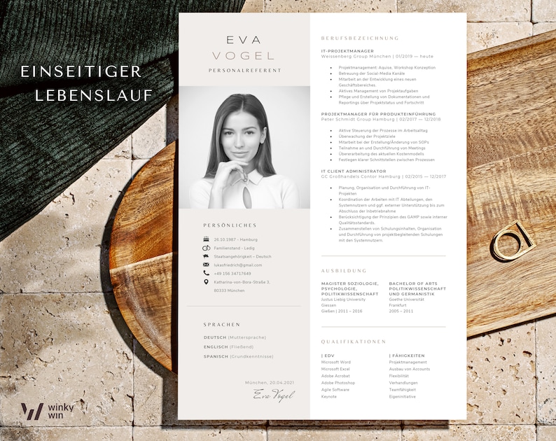 May include: A black and white resume with the name Eva Vogel, Personalreferent, at the top. The resume lists her work experience, education, and qualifications. The resume is on a wooden surface.