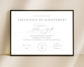 May include: A framed certificate of achievement with a black border. The certificate has text that reads "Certificate of Achievement" and "Presented to Noah Smith." It includes areas for a logo, date, and signature. The background is white.