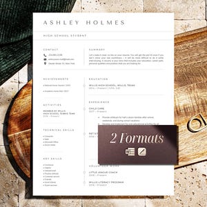 May include: A resume template for a high school student, featuring the name "Ashley Holmes" at the top. The document includes sections for contact information, achievements, activities, technical skills, and key skills. A small graphic reads "2 Formats".