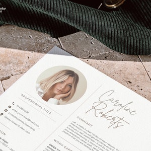 May include: A resume template with a professional headshot of a woman with blonde hair. The resume is titled "Caroline Roberts" and includes a summary, work experience, and education section.
