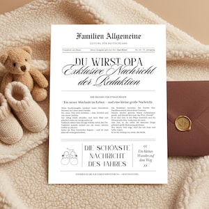 May include: A newspaper-style announcement with the headline "DU WIRST OPA" (You will be a grandfather) in German. The image includes a teddy bear, baby booties, and a sealed envelope.