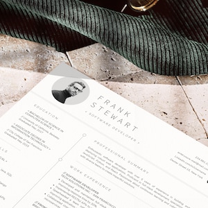 May include: A black and white resume with a headshot of a man wearing glasses. The resume is for Frank Stewart, a Software Developer. The resume includes his education, skills, professional summary, and work experience. The contact information includes his email address, LinkedIn profile, and phone number.
