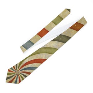 May include: A necktie with a retro design. The tie features a pattern of radiating stripes in red, blue, and green, with a cream-colored background. The necktie's design includes a striped pattern on the neckband.