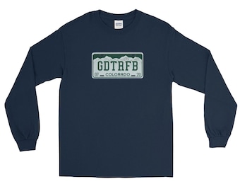 May include: Navy blue long-sleeve shirt featuring a license plate design with the text "GDTAFB" and "COLORADO 20". The license plate design has a green border and a mountain range graphic. The shirt is made of a soft material.