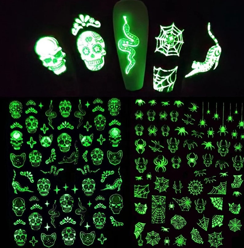 May include: Glow-in-the-dark nail stickers featuring Halloween designs. The stickers include skulls, snakes, spiders, and spiderwebs.